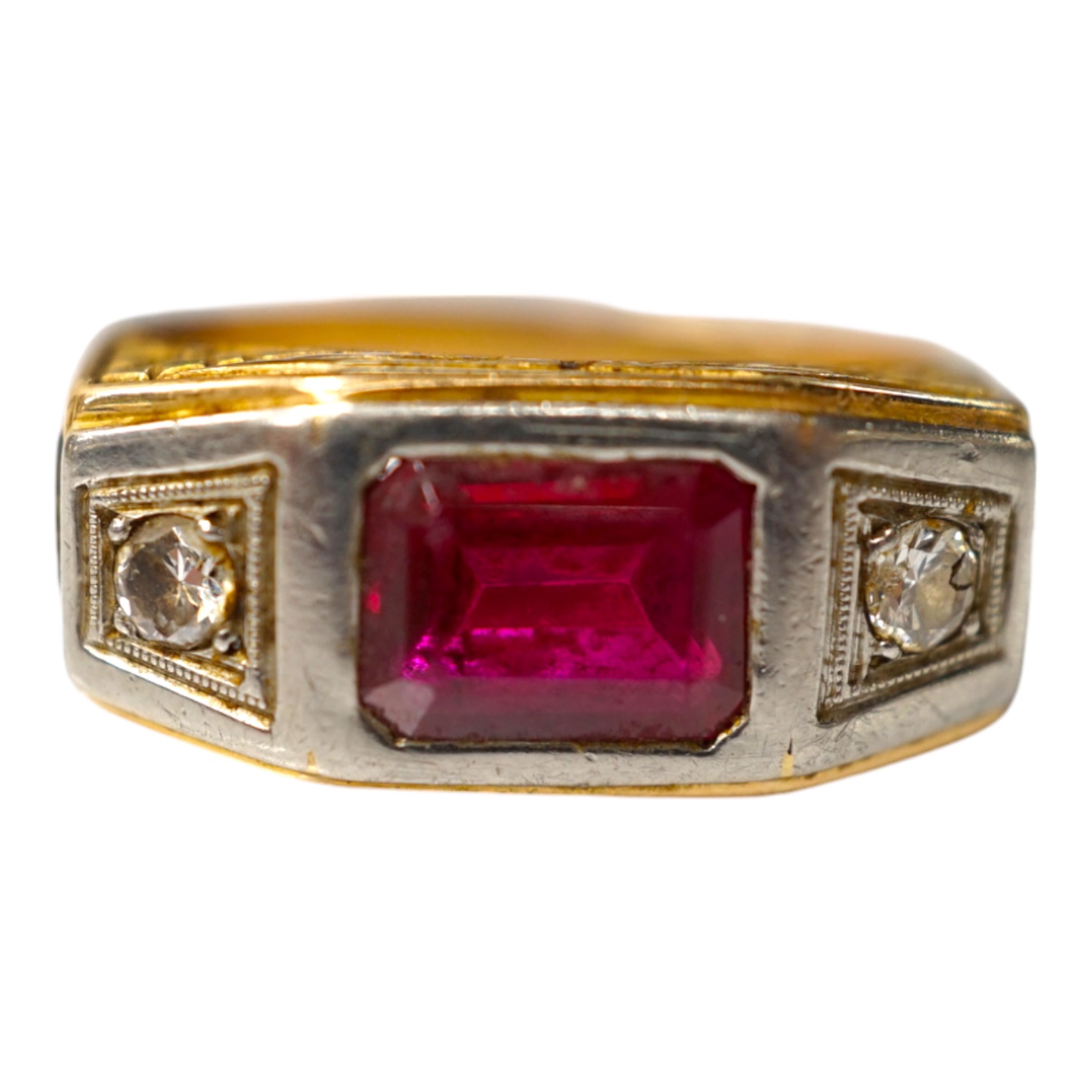 An 18k, single stone synthetic ruby and two stone diamond set ring, the shoulders embossed with LEX and Scales of Justice, size V, gross weight 6.3 grams. Condition - fair.